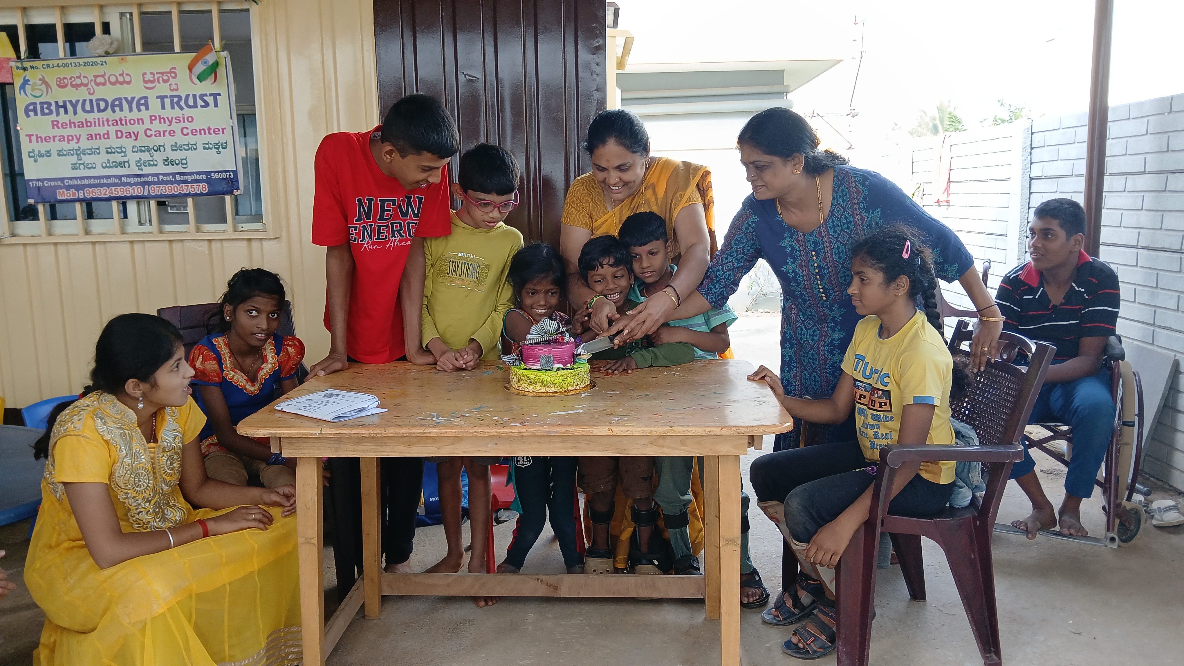 Children at Abhyudaya Trust celebrating with a cake